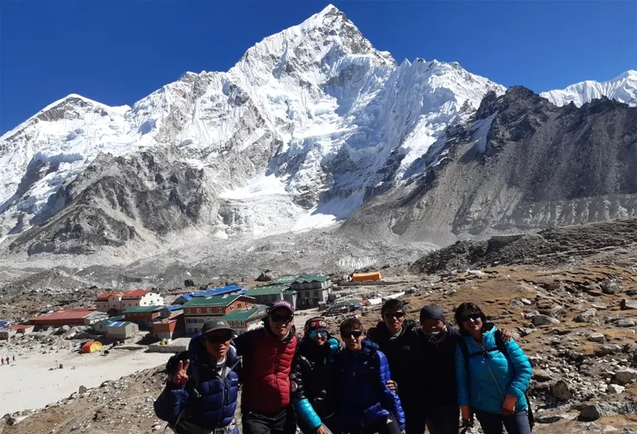 Our trekking group at Gorek Shep with beautiful Nuptse mountain in background