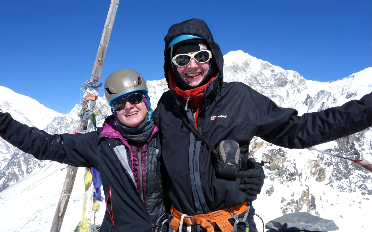 Yala Peak Nepal: The Climber’s Guide To Difficulty, Best Season, And How To Prepare 4 Couple Capturing A Moment On The Summit Of Yala Peak